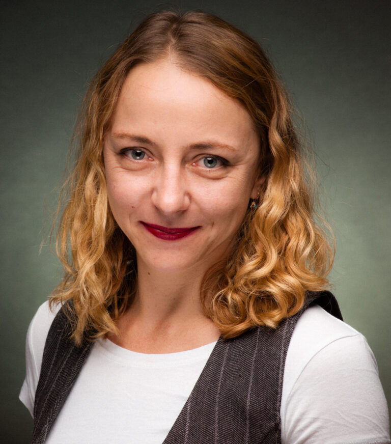 Magda Kufrej, climate career coach and keynote speaker, photographed in a studio portrait